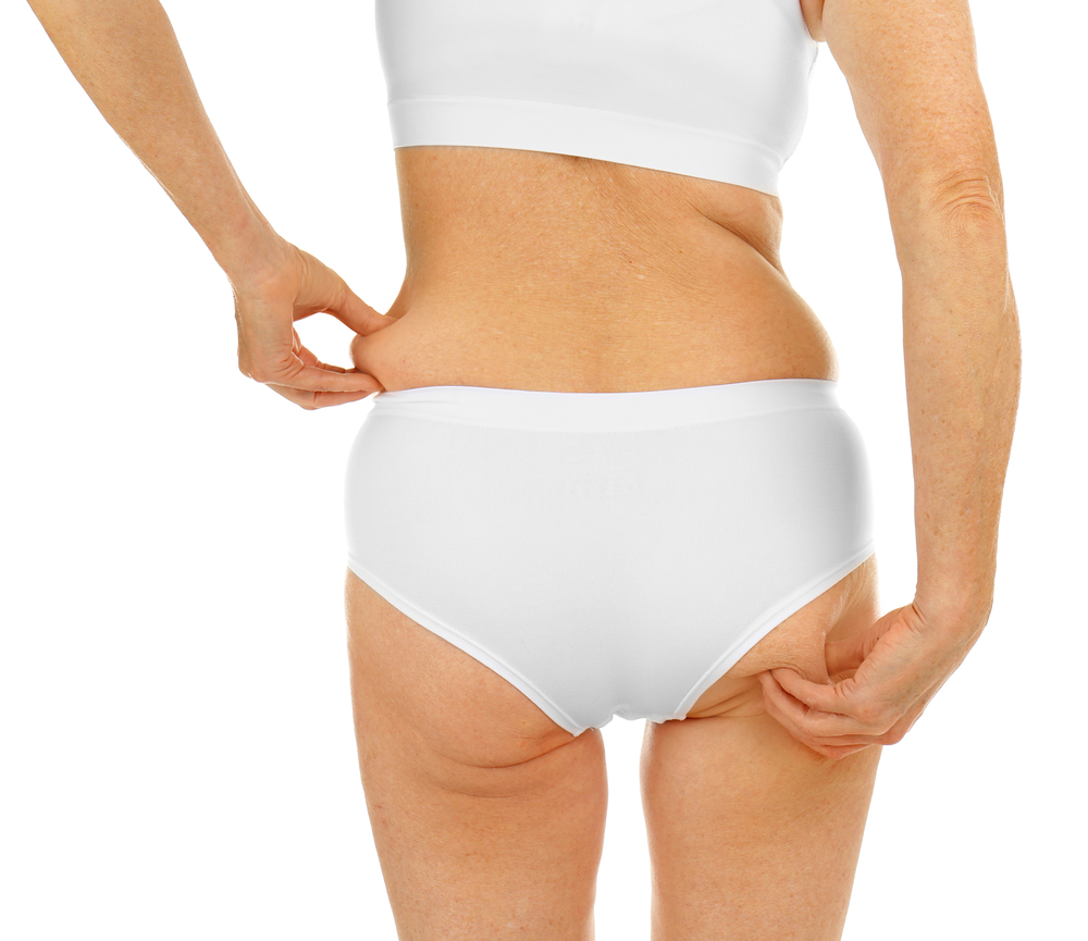 a woman in a white underwear holding her butt