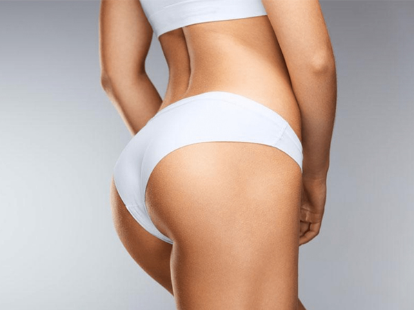 a woman in a white bikini bottom and panties